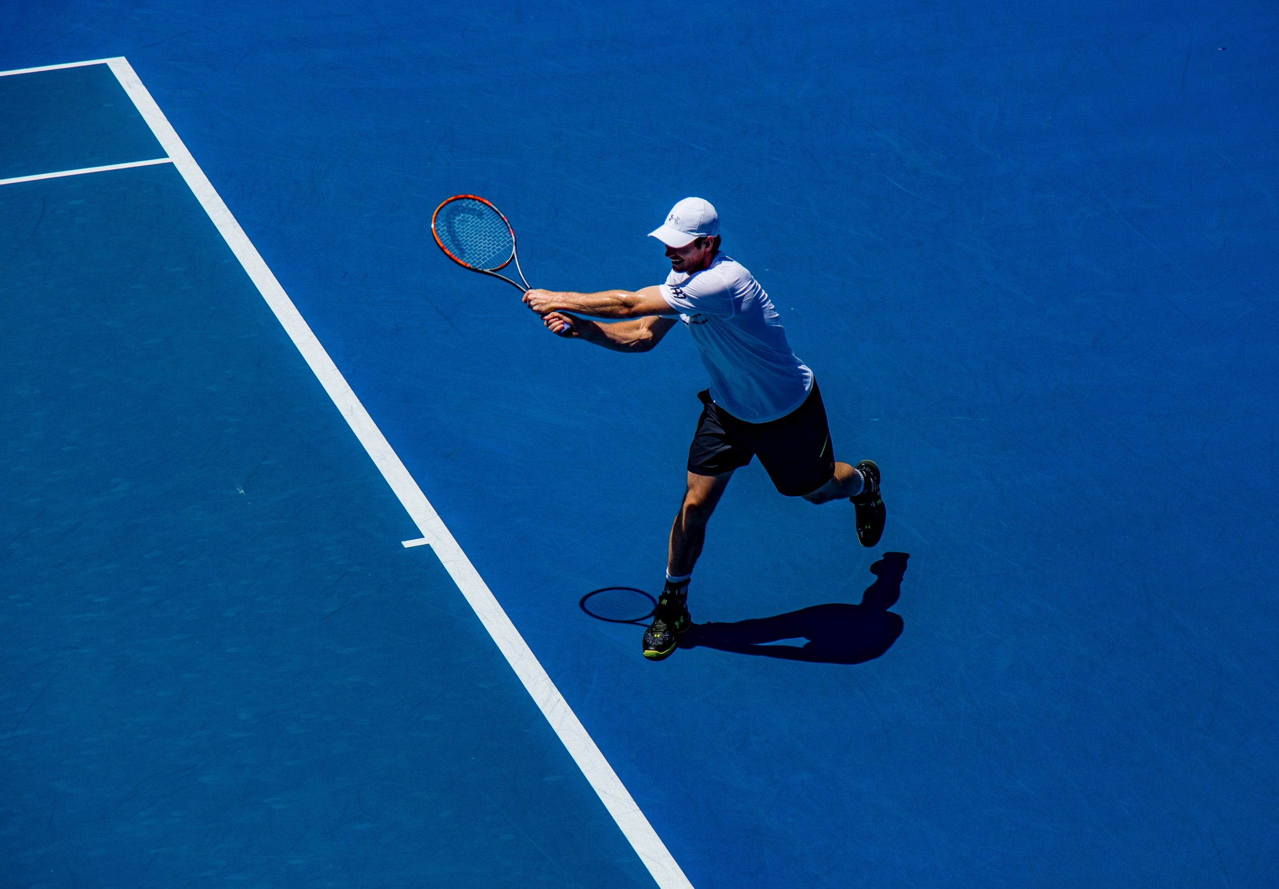 Man playing tennis on field