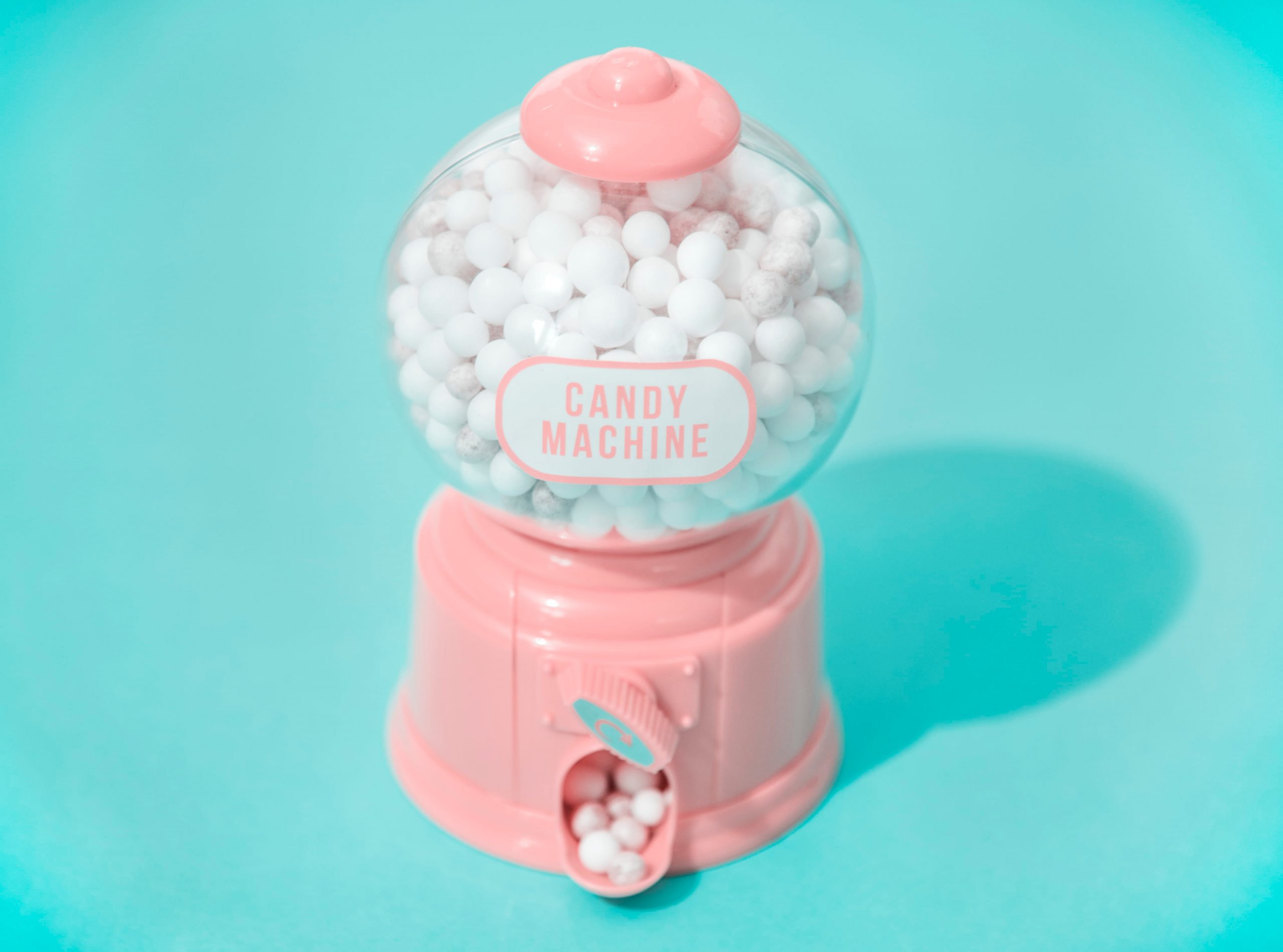 White and pink candy machine dispenser