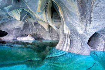 Gray rock formation in water lake cave Chile erosion turquoise wallpaper