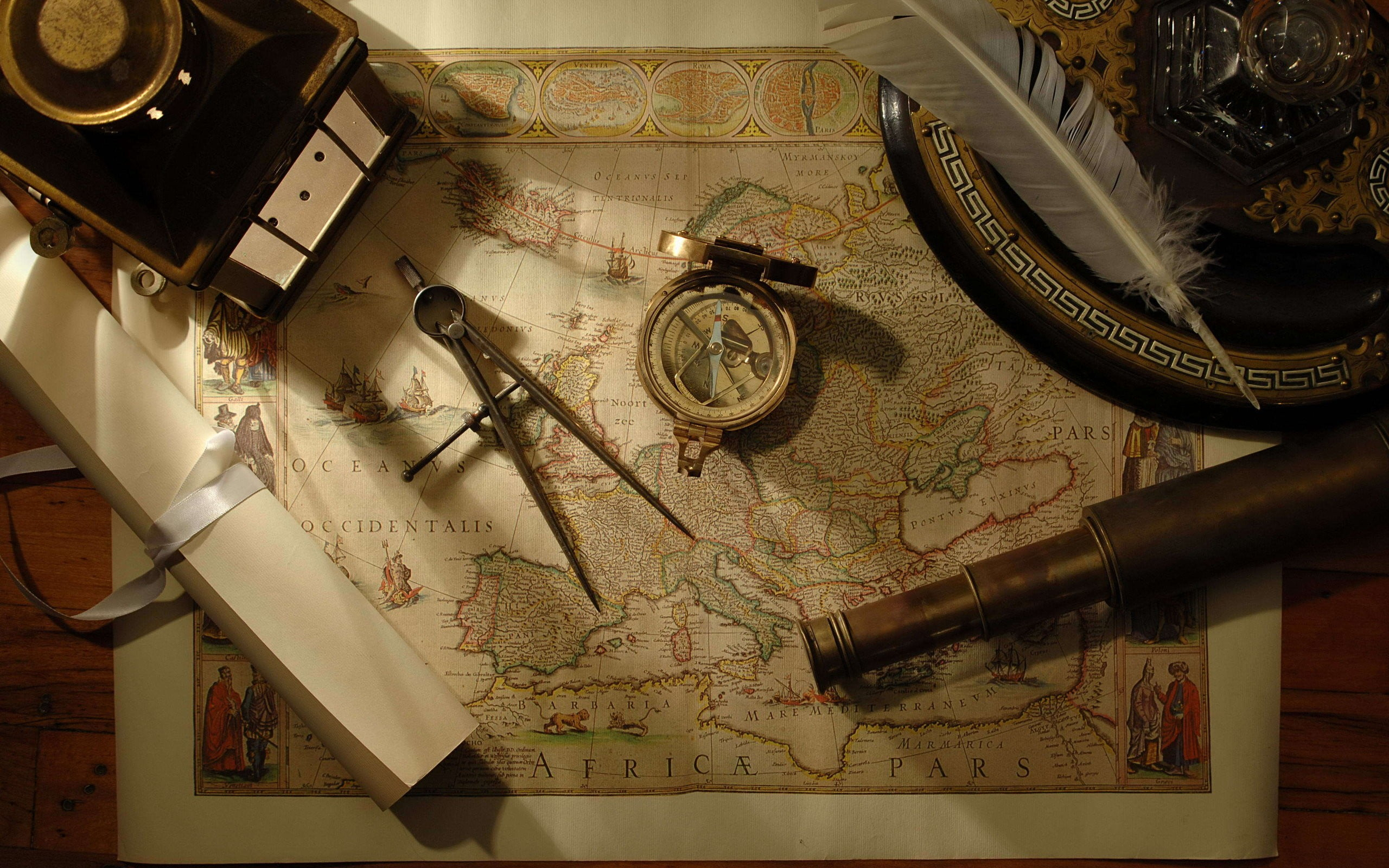 vintage European map, compass, tools, feathers, scrolls, telescope wallpaper