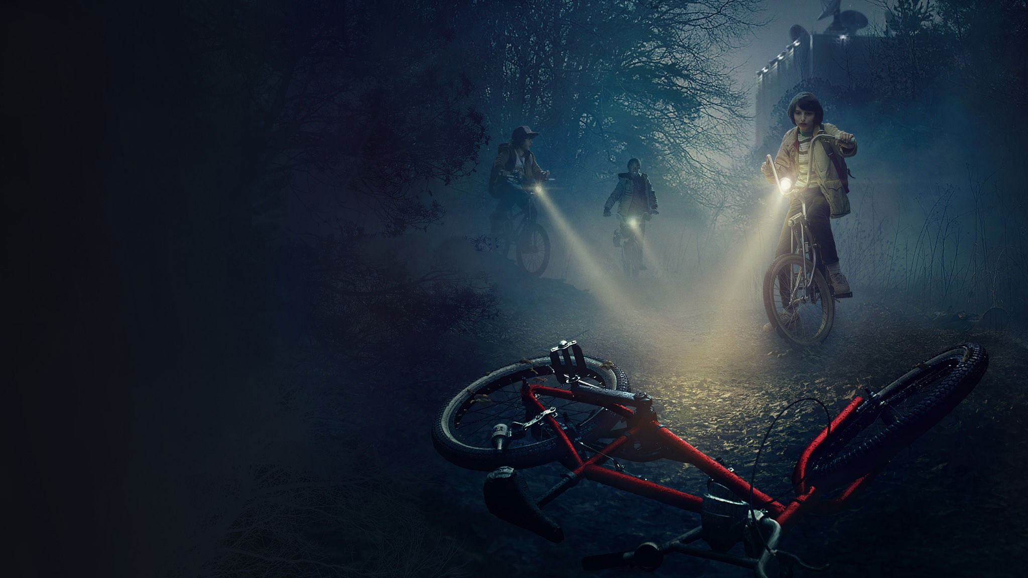 Three people looking at red bicycle on ground digital wallpaper