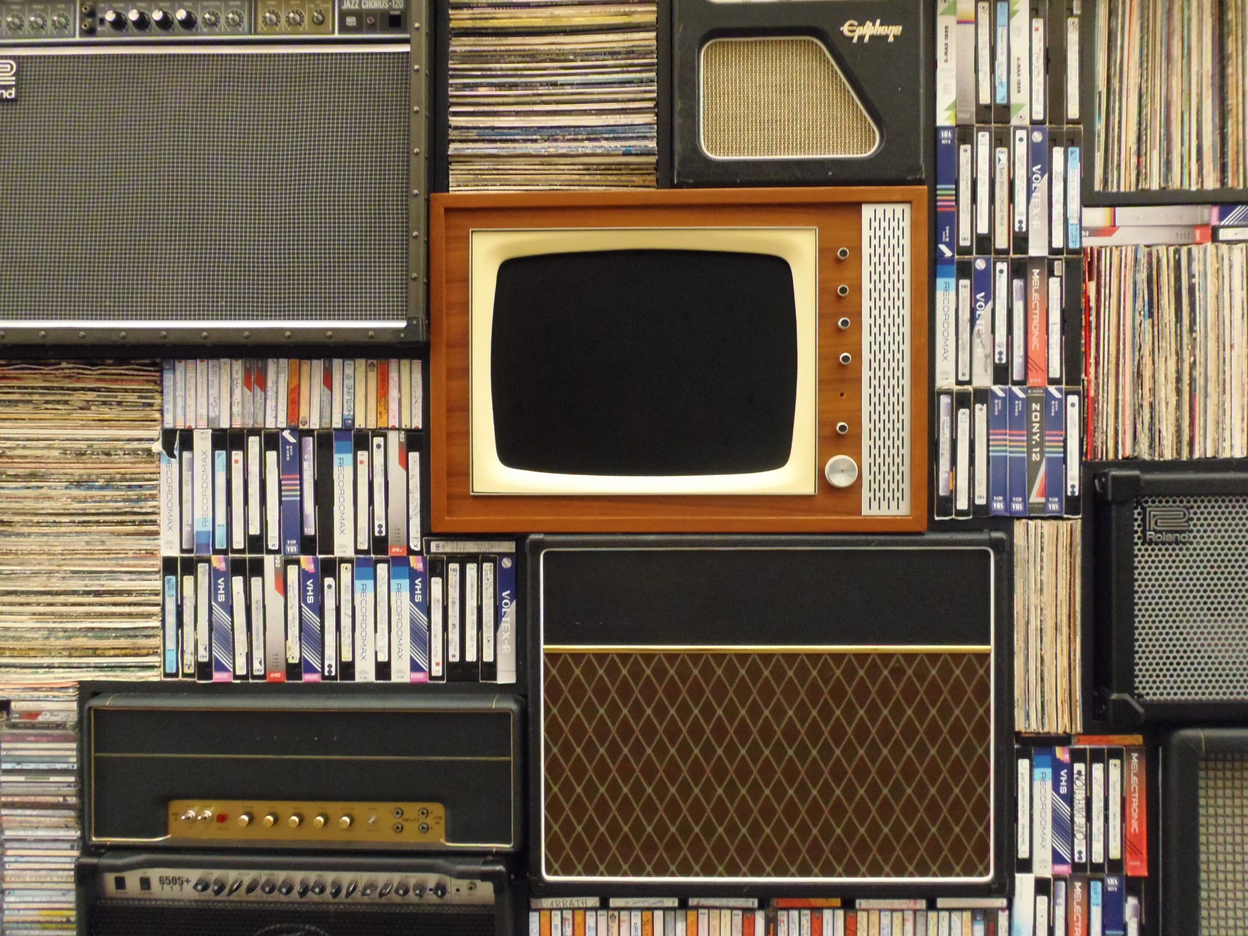 Assorted antique appliance and cassette tapes wallpaper, old tv, records