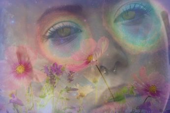 Woman in cat-eyes surrounded with petaled flowers digital wallpaper