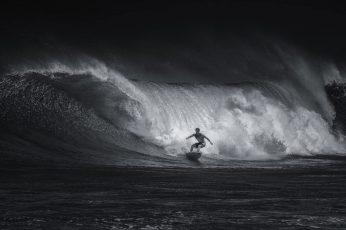 Person surfing, sport, wave, black and white